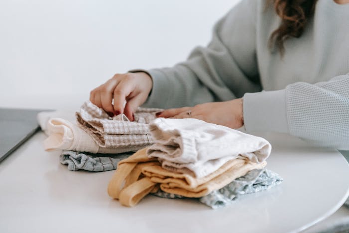 person-folding-laundry